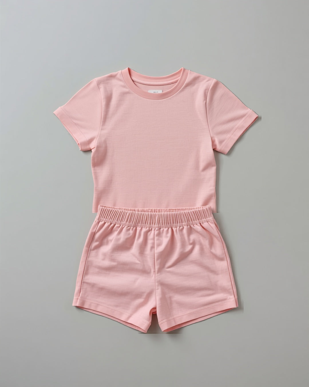 Kids plain pink cotton co-ord set - half sleeve t-shirt and shorts flat lay
