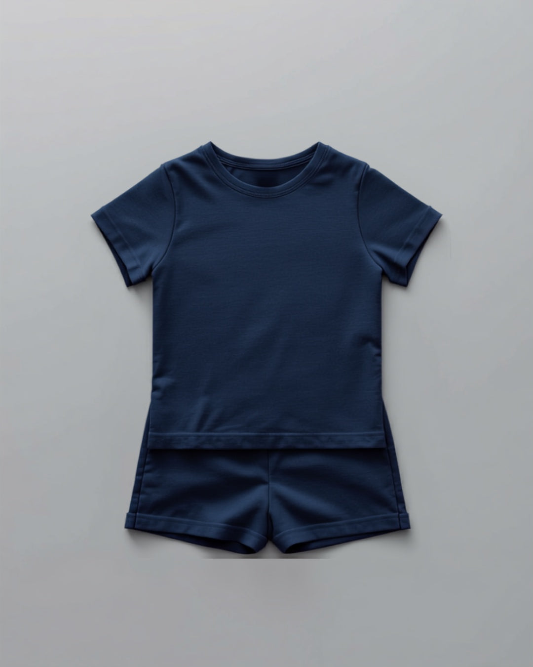 Kids plain navy blue cotton co-ord set - half sleeve t-shirt and shorts flat lay
