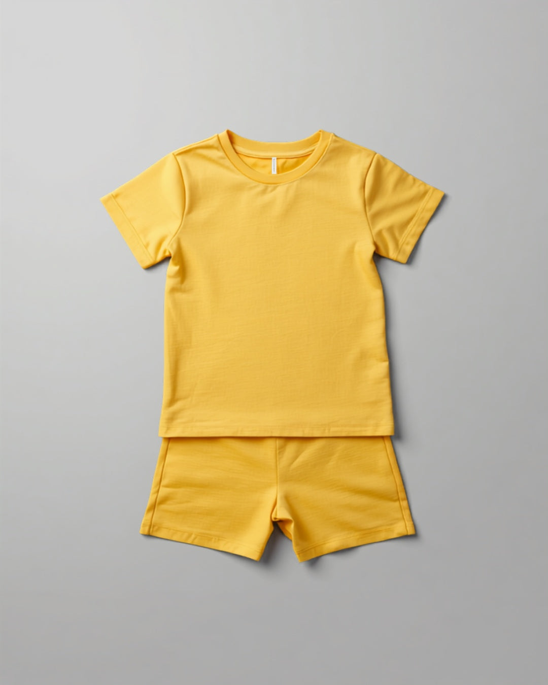 Kids plain yellow cotton co-ord set - half sleeve t-shirt and shorts flat lay