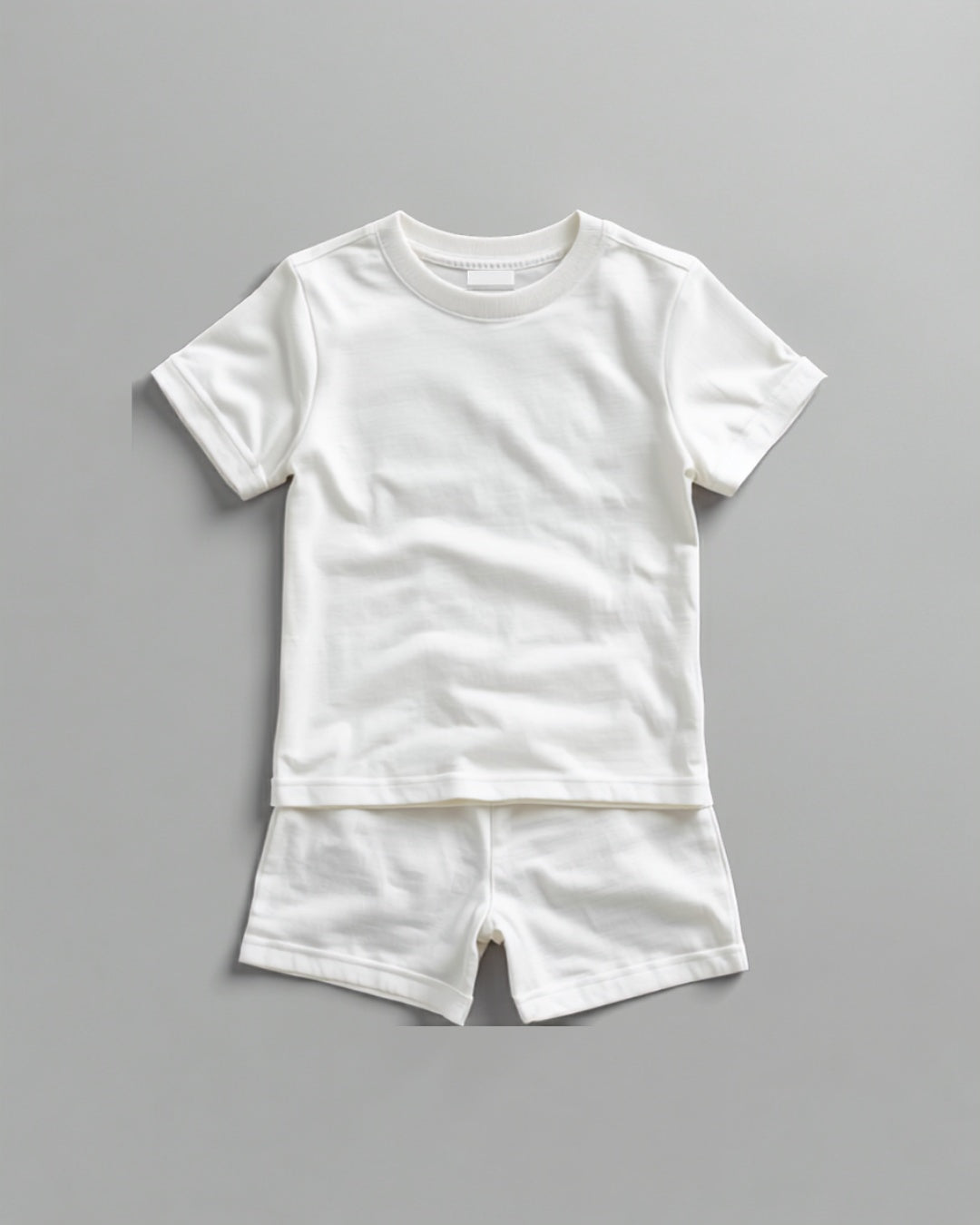 Kids plain white cotton co-ord set - half sleeve t-shirt and shorts flat lay