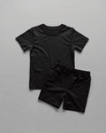 Kids plain black cotton co-ord set - half sleeve t-shirt and shorts flat lay