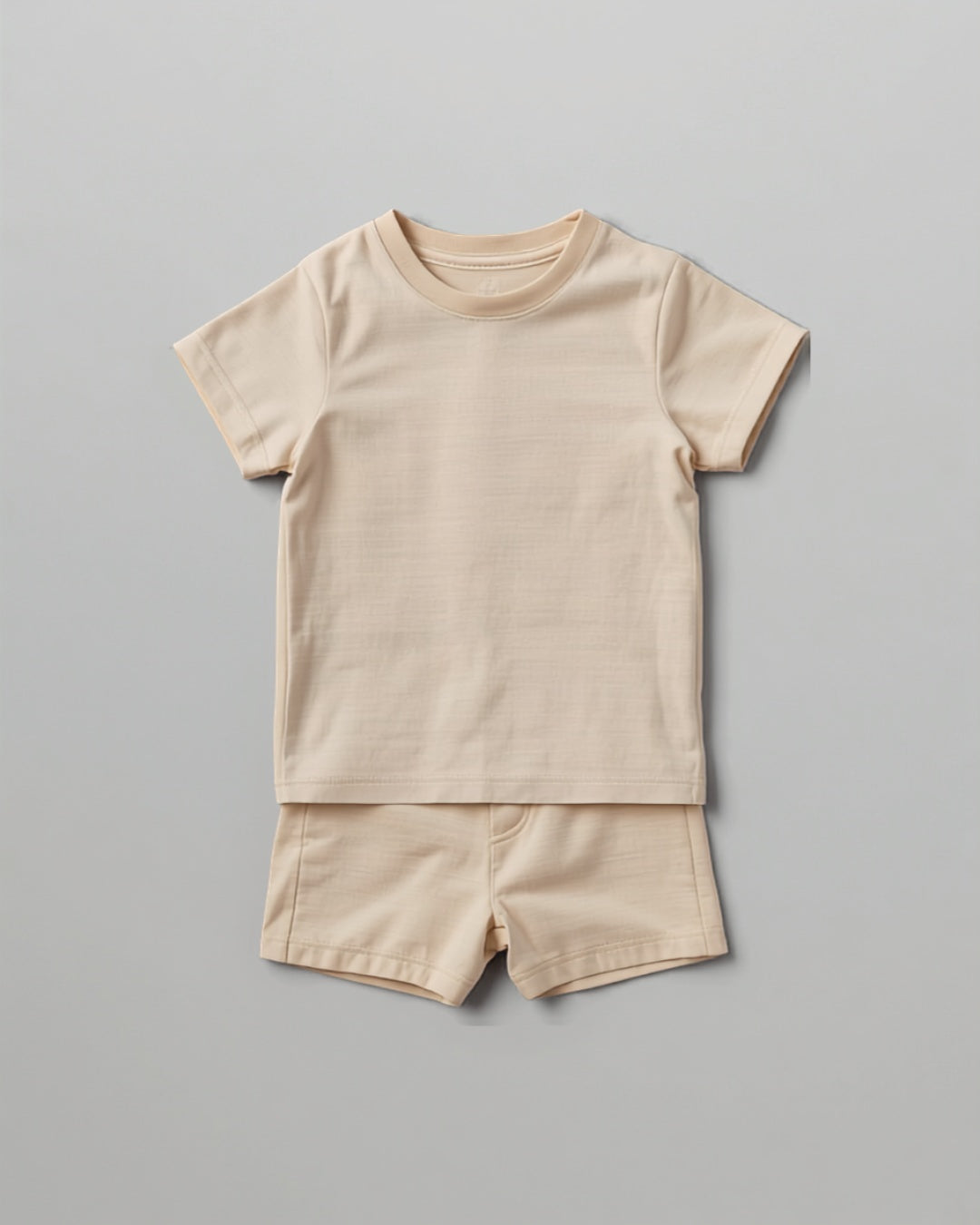 Kids plain beige cotton co-ord set - half sleeve t-shirt and shorts flat lay