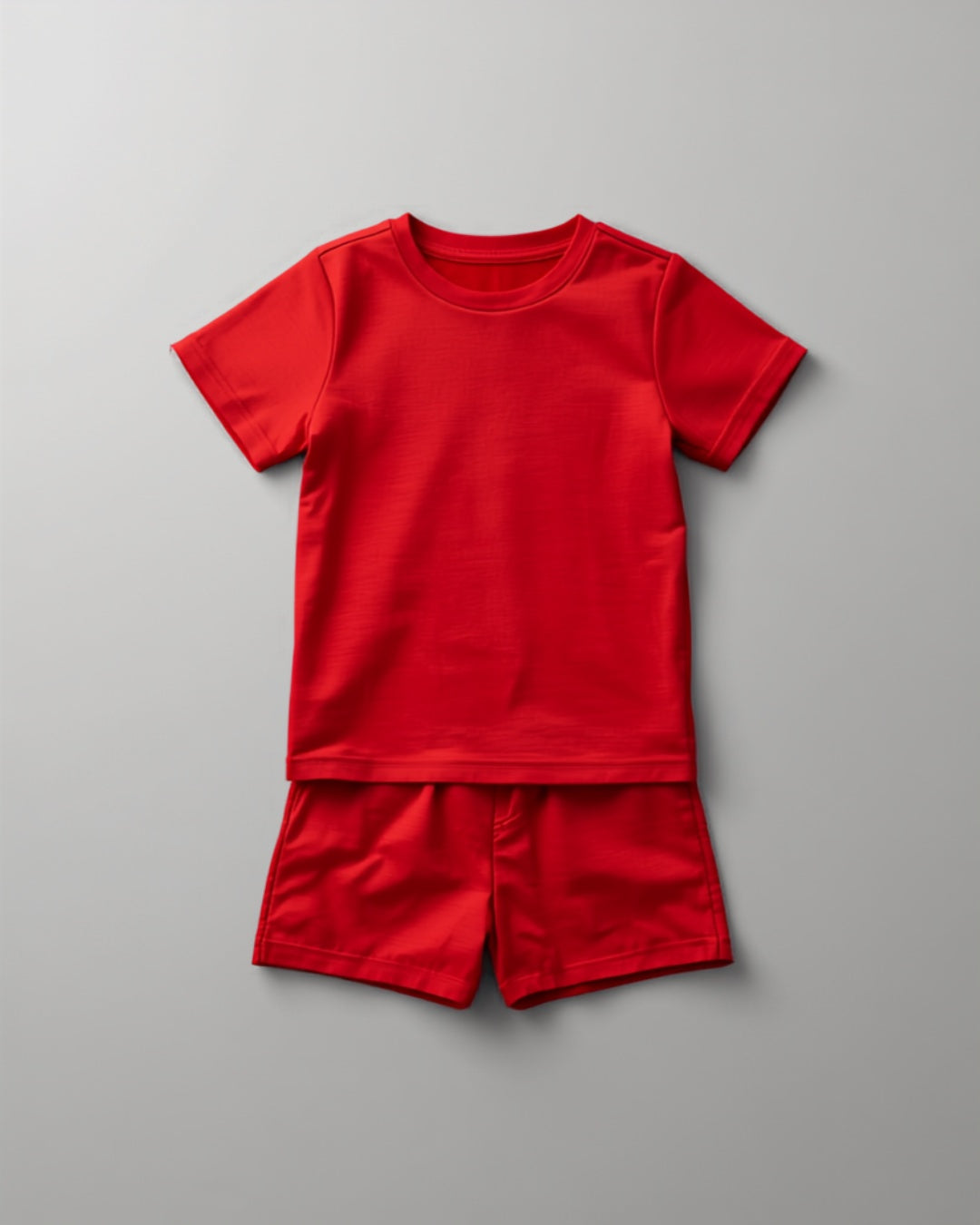 Kids plain red cotton co-ord set - half sleeve t-shirt and shorts flat lay